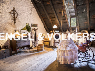 Discover this unique attic space, brimming with rustic charm and character.