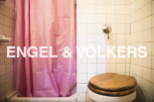 Charming bathroom with pink shower curtain and wooden toilet seat.
