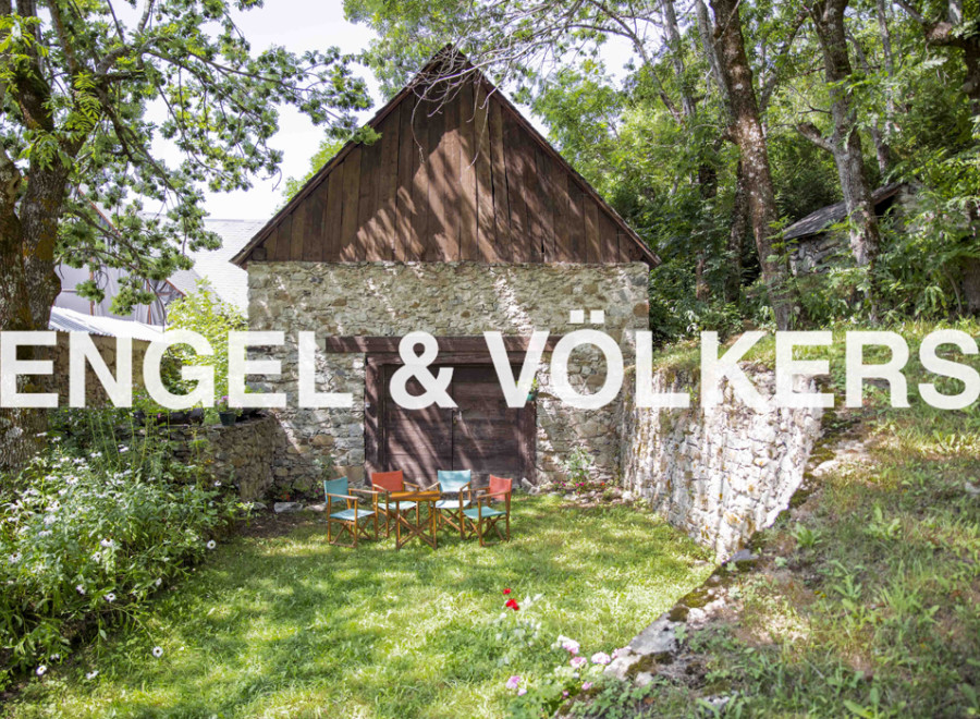 Charming stone barn conversion nestled in a serene wooded setting.