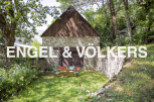 Charming stone barn conversion nestled in a serene wooded setting.
