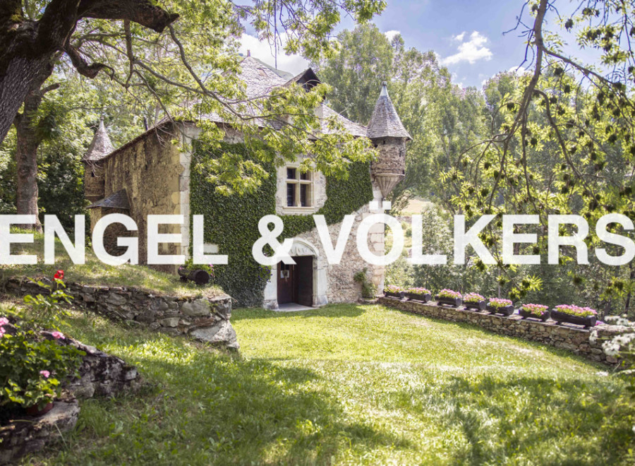 Discover this enchanting stone house nestled in a serene landscape.