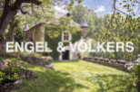 Discover this enchanting stone house nestled in a serene landscape.