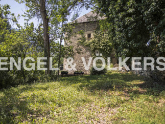 Discover this charming stone house nestled amidst lush greenery, offering a tranquil escape.