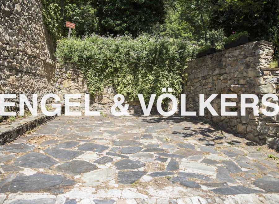 Discover this charming property nestled amidst lush greenery and ancient stone walls.