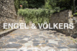 Discover this charming property nestled amidst lush greenery and ancient stone walls.