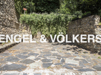 Discover this charming property nestled amidst lush greenery and ancient stone walls.