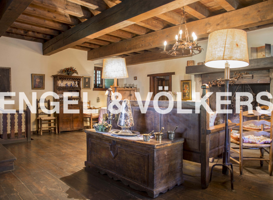 This stunning property boasts a wealth of original features, including exposed wooden beams and antique furnishings.