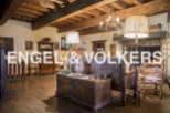 This stunning property boasts a wealth of original features, including exposed wooden beams and antique furnishings.