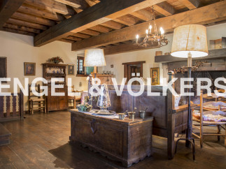 This stunning property boasts a wealth of original features, including exposed wooden beams and antique furnishings.