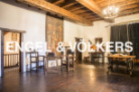 This stunning property boasts a spacious interior with exposed wooden beams and hardwood floors.
