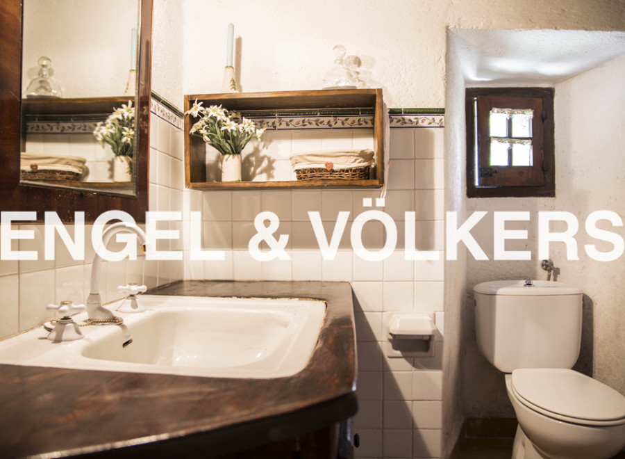 Charming bathroom with vintage sink and toilet.