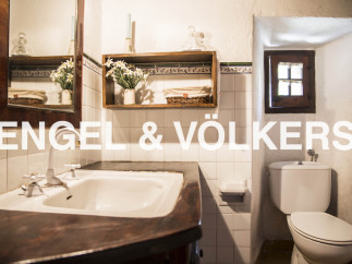 Charming bathroom with vintage sink and toilet.
