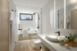 This stunning bathroom boasts a spacious design with modern fixtures and finishes.