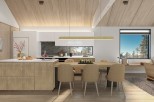 This stunning kitchen boasts a modern design with light wood cabinets and a large island, perfect for entertaining.