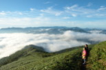 Enjoy breathtaking views from this mountain peak, where a sea of clouds blankets the valleys below.