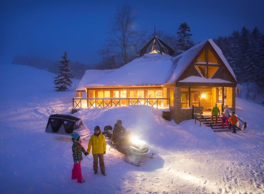Experience the magic of winter at this stunning snow-covered lodge.