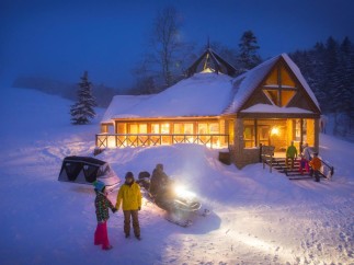 Experience the magic of winter at this stunning snow-covered lodge.