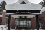 The Village Alpha welcomes guests with a charming entrance, perfect for a winter getaway.