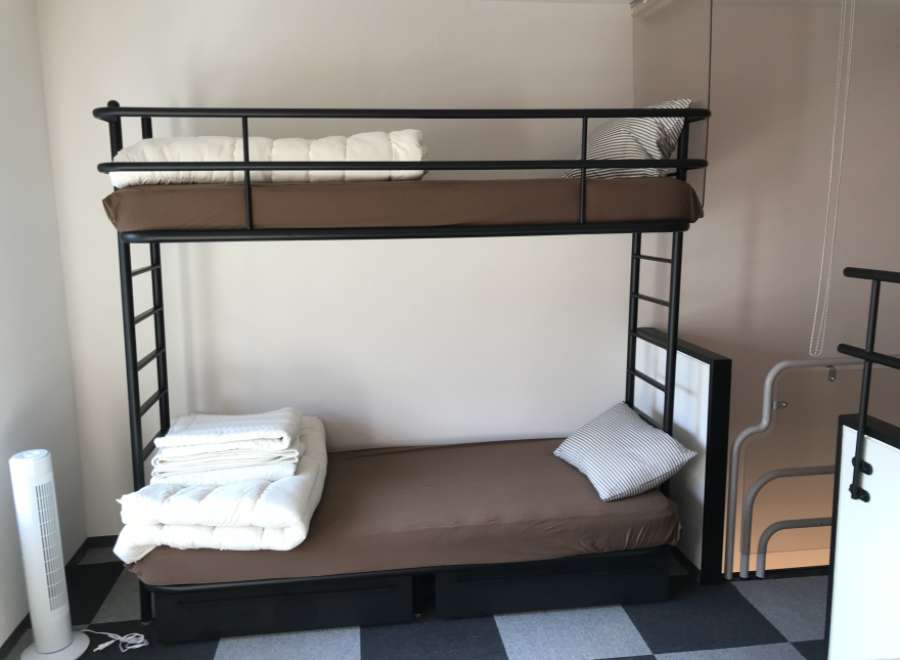 This cozy room features a sturdy bunk bed, perfect for accommodating guests or family members.