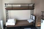 This cozy room features a sturdy bunk bed, perfect for accommodating guests or family members.