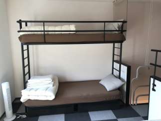 This cozy room features a sturdy bunk bed, perfect for accommodating guests or family members.