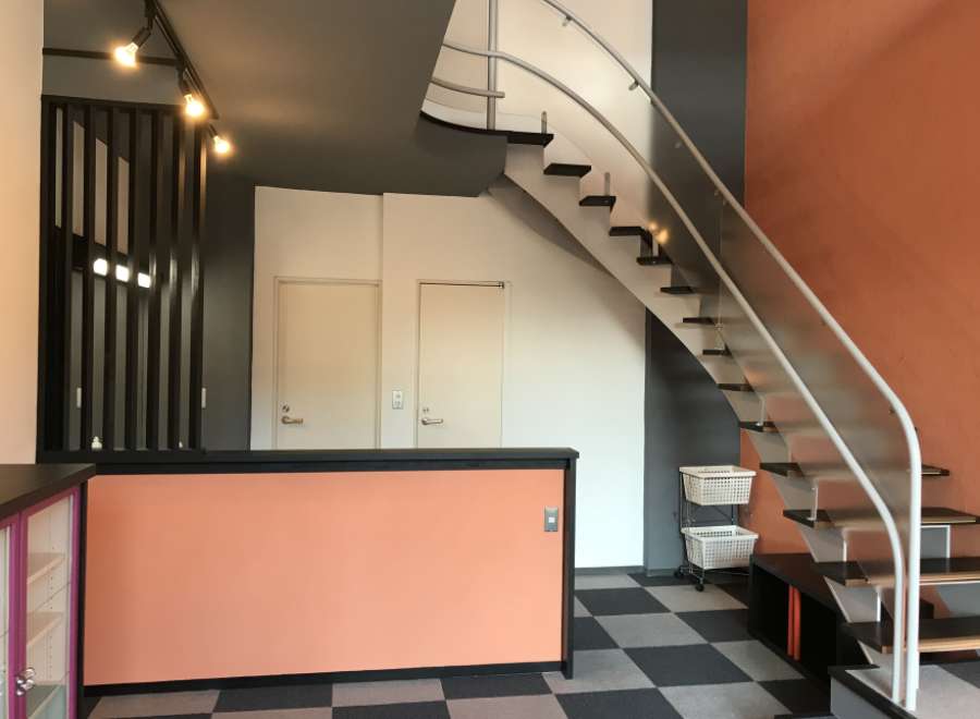 This property features a modern interior with a unique staircase design.