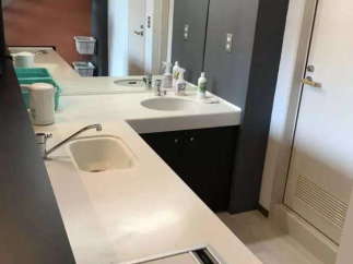 Modern and stylish kitchen with sleek countertops and a built-in cooktop.
