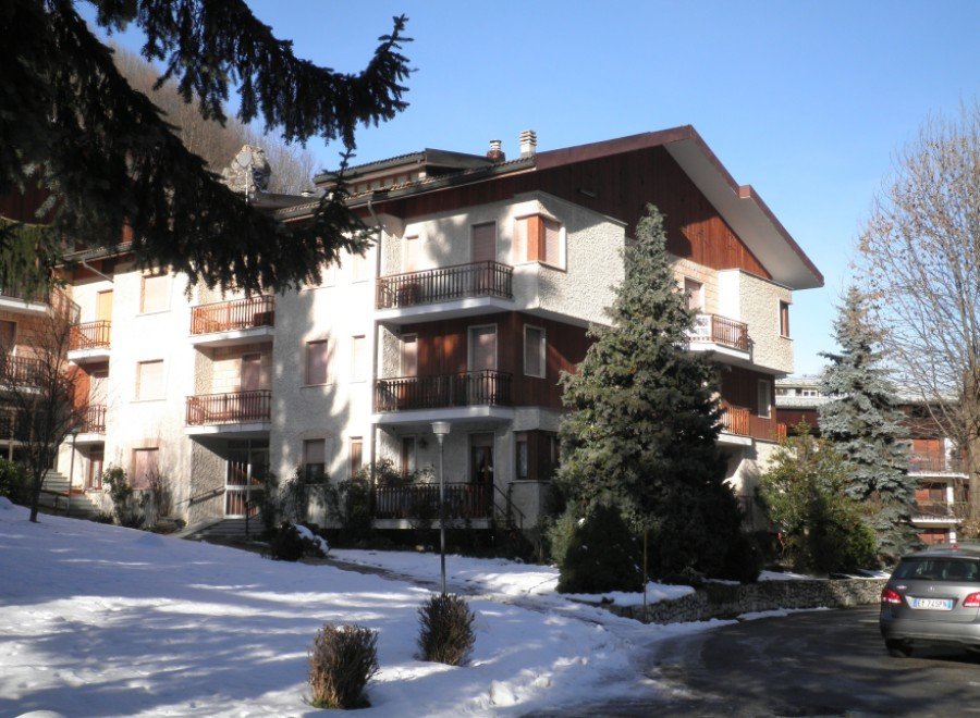 This stunning property boasts a charming facade with multiple balconies, offering picturesque views.