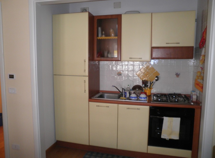 This cozy kitchen features a compact design, perfect for maximizing space.