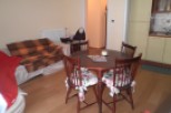 Cozy apartment with a charming dining area.