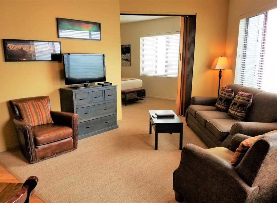 Cozy living room with comfortable seating and a flat-screen TV.