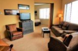 Cozy living room with comfortable seating and a flat-screen TV.