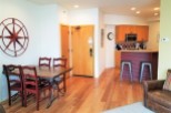 Discover this charming property featuring a cozy dining area with a stylish wooden table and chairs.