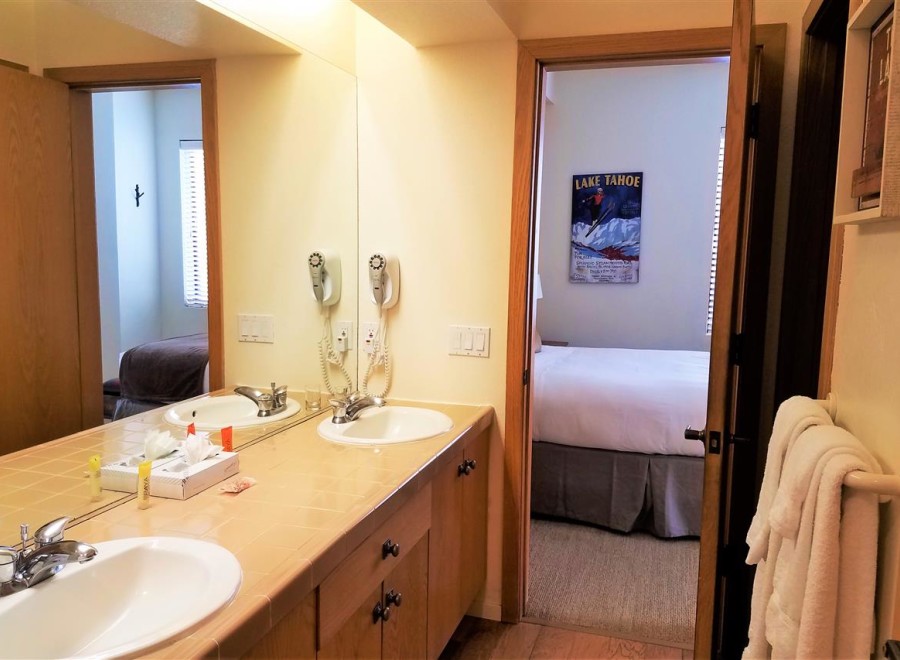 This inviting bathroom features a double vanity with ample counter space, perfect for getting ready.