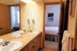 This inviting bathroom features a double vanity with ample counter space, perfect for getting ready.