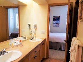 This inviting bathroom features a double vanity with ample counter space, perfect for getting ready.