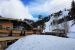 Enjoy a winter wonderland at this stunning ski resort! The "Olympic House" offers a cozy retreat with breathtaking views of the snowy slopes and cable cars.