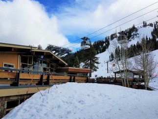 Enjoy a winter wonderland at this stunning ski resort! The "Olympic House" offers a cozy retreat with breathtaking views of the snowy slopes and cable cars.