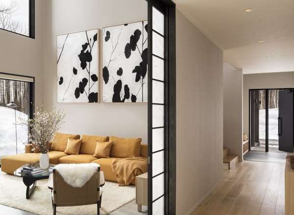 This stunning home boasts a spacious open floor plan with floor-to-ceiling windows offering breathtaking views.