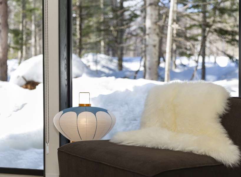Cozy up by the window with a sheepskin throw and enjoy the snowy winter view.