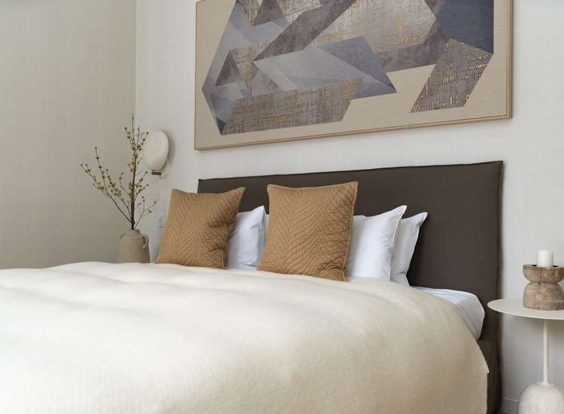 Calm and sophisticated bedroom with a neutral color palette.