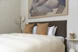 Calm and sophisticated bedroom with a neutral color palette.