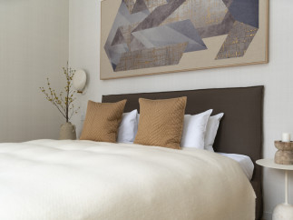 Calm and sophisticated bedroom with a neutral color palette.