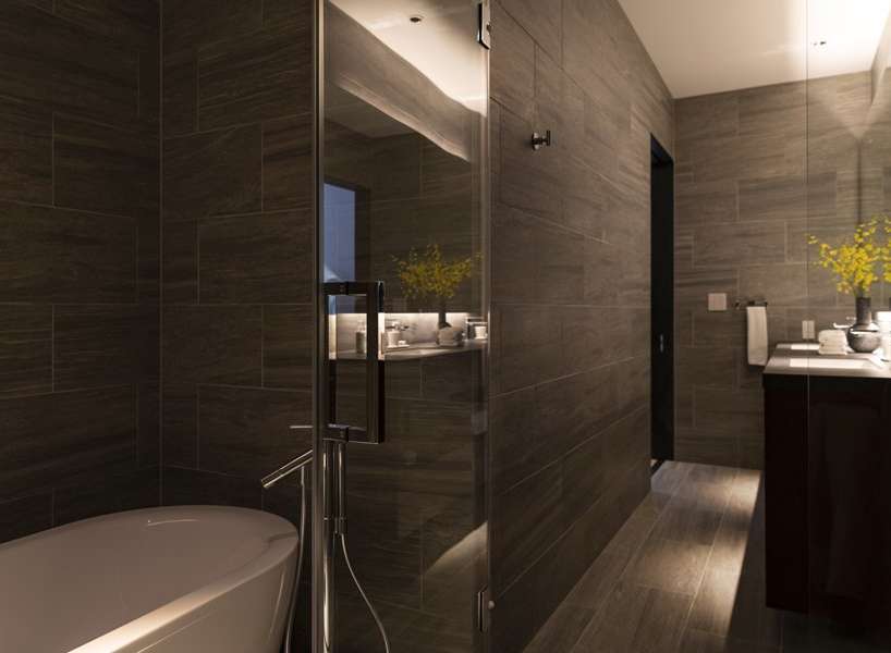 This luxurious bathroom boasts a sleek, modern design with dark brown tile, a frameless glass shower enclosure, and a freestanding soaking tub.