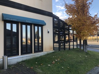 This charming restaurant boasts a modern design with large windows offering ample natural light and views of the surrounding landscape.
