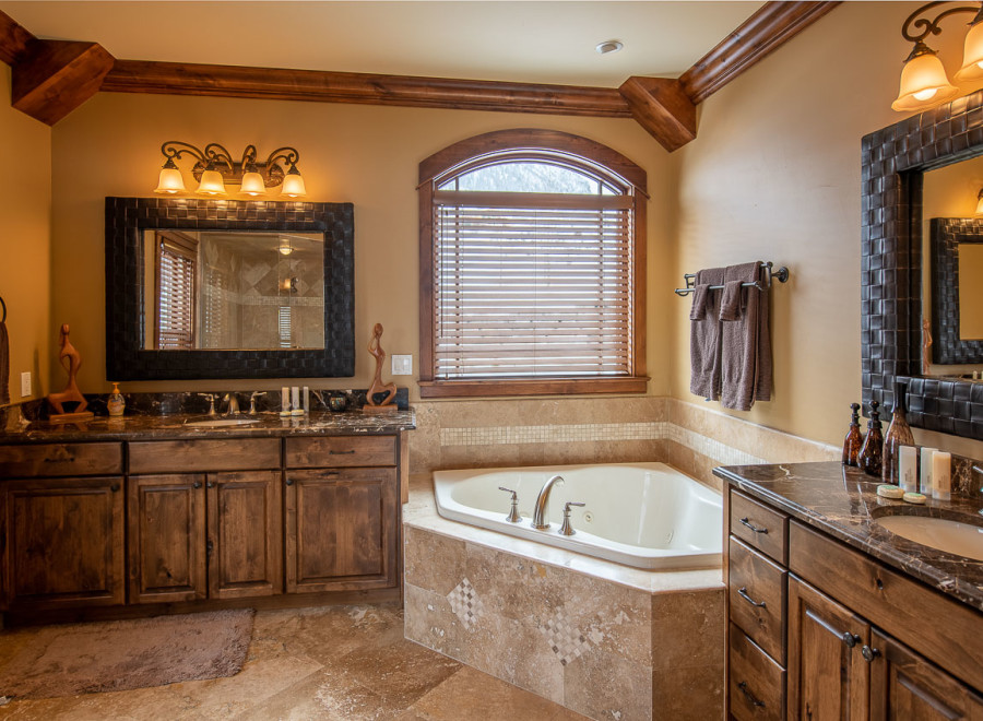 This luxurious bathroom boasts a spacious corner jacuzzi tub, perfect for relaxation.