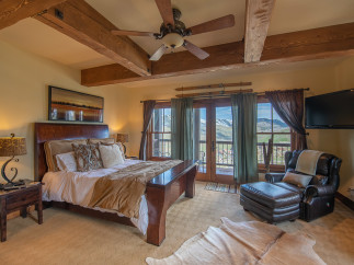 Luxurious mountaintop bedroom with stunning views.