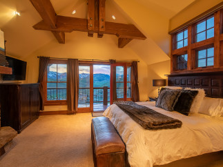 Luxurious mountaintop bedroom with breathtaking views.