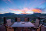 Wake up to breathtaking sunrise views over the majestic mountain range from your private deck.