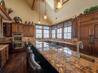This stunning kitchen boasts a large island with seating, perfect for entertaining.